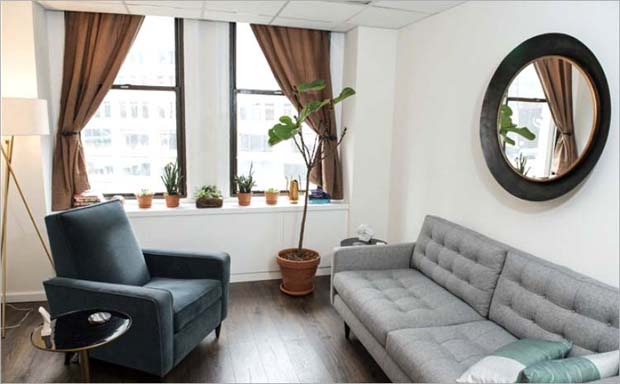 Comfortable therapy room with seating area and natural light